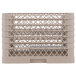 A beige plastic Vollrath Traex plate rack with 20 compartments.