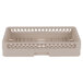 A beige plastic dish rack with holes.