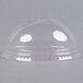A clear plastic dome lid on a clear plastic container.