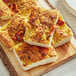 A cutting board with pieces of Lesaffre bread yeast on it.