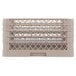 A beige Vollrath Traex plate rack with 32 compartments.