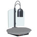A black lamp on a grey surface.