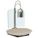 A Hatco carving station with a silver lamp over a white heated base.