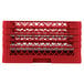 A red plastic Vollrath Traex plate rack with 22 compartments.
