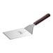 A Mercer Culinary Hell's Handle square edge turner with a wooden handle.