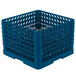 A blue plastic Vollrath Traex plate rack with 12 compartments and silver metal rods.