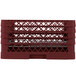 A red plastic Vollrath Traex Plate Crate with rows of holes.