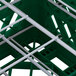 A green Vollrath Traex Plate Crate with metal dividers.