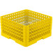 A yellow plastic Vollrath Traex Plate Crate with metal dividers.