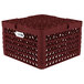 A red Vollrath Traex plate rack with 12 compartments and holes in it.