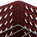 A burgundy Vollrath Traex Plate Crate dish rack with 12 compartments.