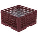 A burgundy plastic Vollrath Plate Crate with metal racks inside.