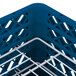 A royal blue plastic Vollrath Traex plate rack with white metal rods.
