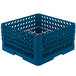 A blue plastic Vollrath Traex plate rack with 12 compartments.