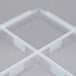 A white plastic Vollrath glass rack trim divider with 9 compartments.