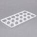 A white plastic grid tray for Vollrath glass racks with 18 compartments.