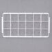 A white plastic rectangular frame with 18 square compartments.