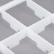 A white plastic grid with holes.