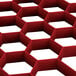 A red hexagon Vollrath glass rack extender.