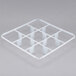 A white plastic grid tray with 9 compartments and holes.