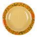 A yellow Venetian bowl with orange and green floral designs.