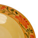 A white melamine bowl with a flower painted on the inside.