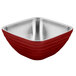 A red and silver Vollrath square serving bowl with a stainless steel handle.