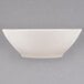 A Homer Laughlin ivory china cereal bowl on a white surface