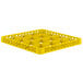 A yellow plastic Vollrath Traex glass rack extender with compartments.