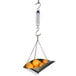 A Taylor hanging spring scale weighing a bowl of oranges.