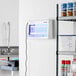A white rectangular Lavex Zap N Trap device with blue lights on the wall.