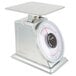 A silver Taylor heavy duty mechanical scale with a white circle on the top.