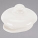 A white ceramic container with a lid.