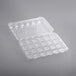 A clear plastic InnoPak container with 24 compartments and a hinged lid.