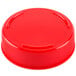 A close-up of a red plastic bottle cap.