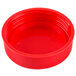A close-up of a red plastic bottle cap.