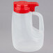 A Tablecraft 48 oz. dispenser jar with a red lid.