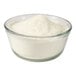 A bowl of malted milk powder on a white background.