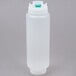 A white plastic squeeze bottle with a blue cap.