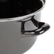 A close-up of a black Hendi enameled steel mussel pot with a handle and lid.