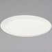 A Homer Laughlin ivory coupe oval china platter on a gray surface.