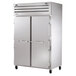 A True stainless steel refrigerator with two solid doors.