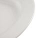 A close-up of a white CAC china platter with a curved rim.