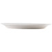 An ivory oval china platter with a wide ivory rim.