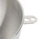 A stainless steel KitchenAid mixing bowl with a handle.