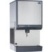 A large silver stainless steel Follett countertop ice maker / dispenser.