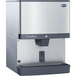 A silver and black Follett countertop ice dispenser.