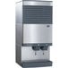 A Follett stainless steel countertop ice machine with two water dispensers.