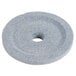 A circular gray stone grinding wheel with a hole in the center.