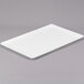 A white rectangular tray on a gray surface.